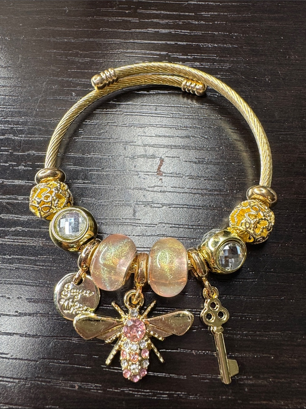 Gold-Tone Bee Charm Bracelet with Pink Crystal Accents